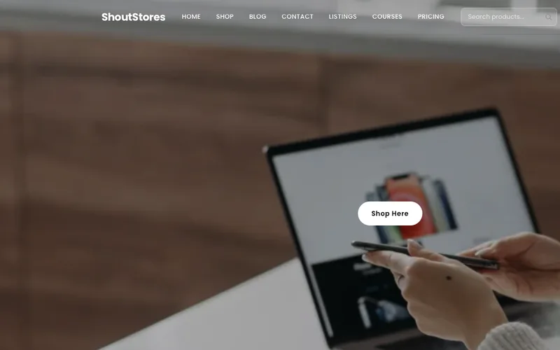 The ShoutStores shop homepage: a storefront with Shop, Listings, Courses and Pricing in the menu and a Shop Here button.